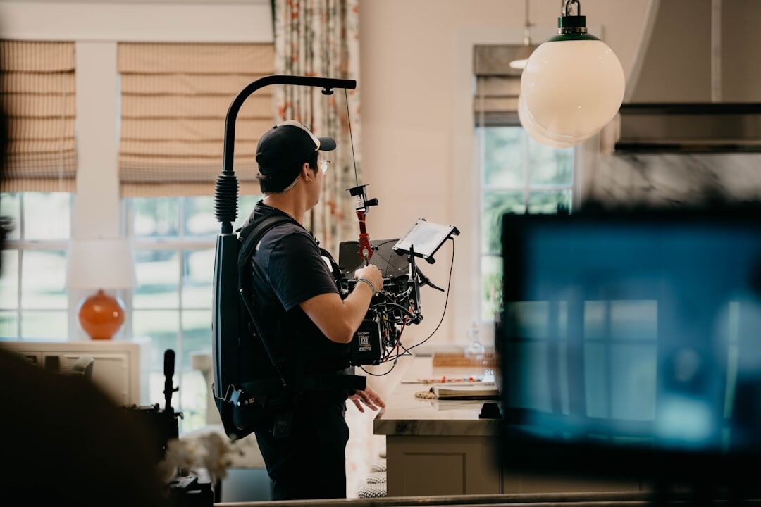 Television production crew operating cameras in a studio